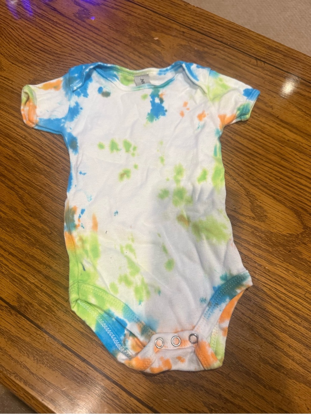 6 for $10 Tie-Dye Short Sleeve Baby One-Piece in White with Blue, Green & Orange